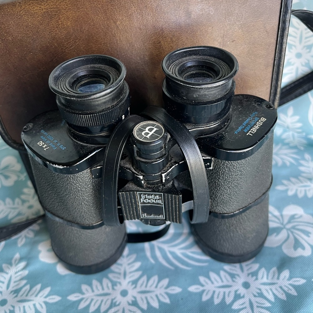 Vintage Bushnell 7x 50 binoculars and case with strap.